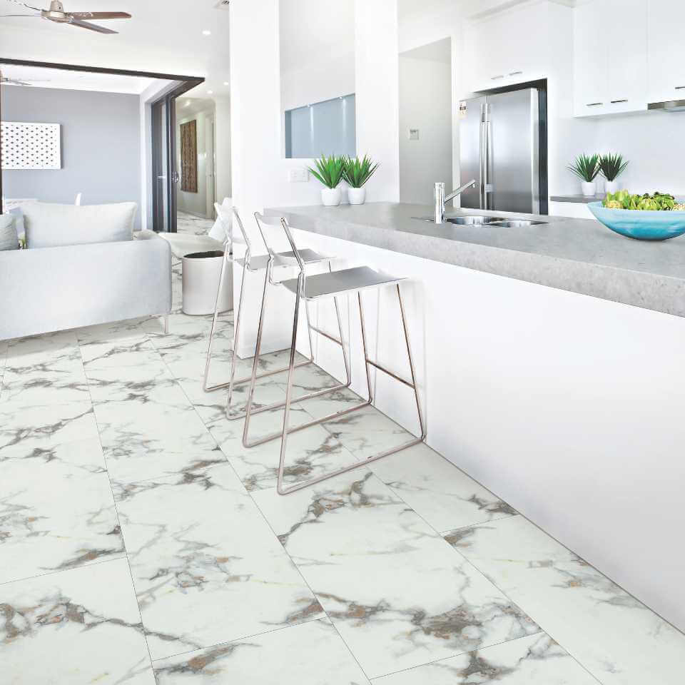 A kitchen with marble flooring